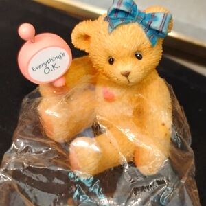 Adorable baby bear with sign dated 1997